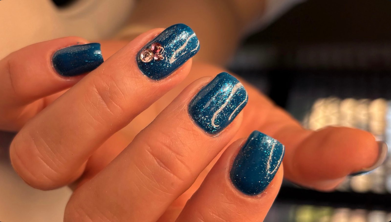 Russian manicure BIAB and colour in blue with glitter and gemstones at Queen Bee Nails in Rockingham WA