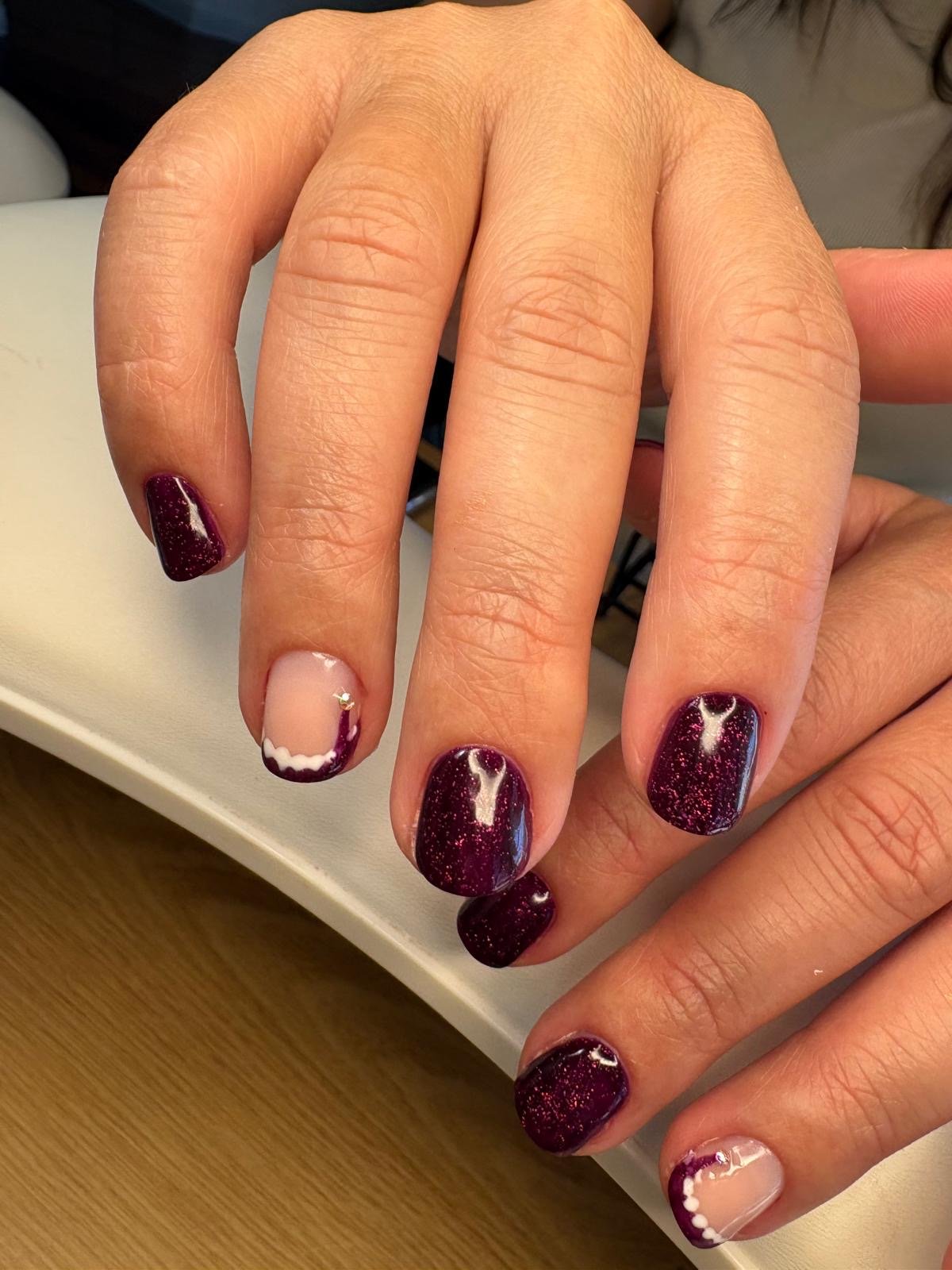 Russian manicure BIAB and colour in burgundy glitter with christmas hat nail art at Queen Bee Nails in Rockingham WA