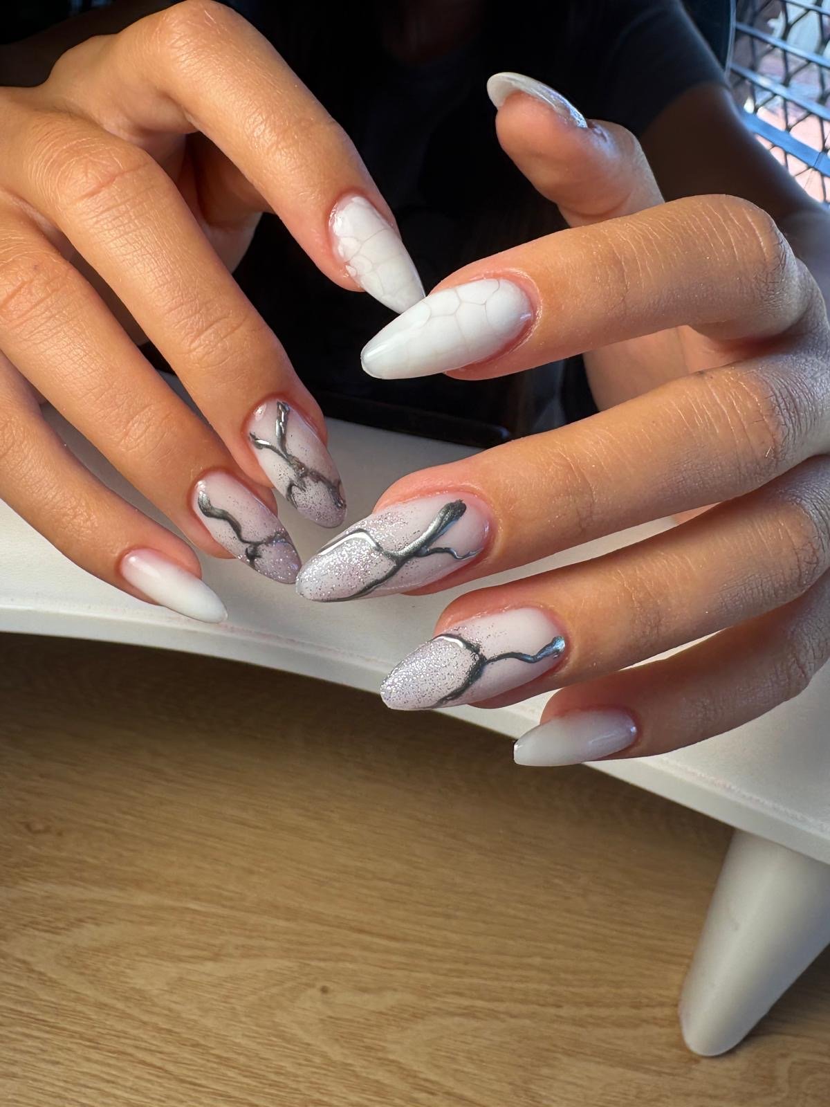 Russian manicure hard gel and colour in blooming white marble stiletto nail extensions with silver glitter detailing by Queen Bee Nails in Rockingham WA